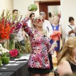 Lisa Weddel, AAF, AIFD, PFCI, of L. Weddel Design in Highlands Ranch, Colorado plays up the retro lingo and attire for last year’s 70s-themed Premier Product Showcase.