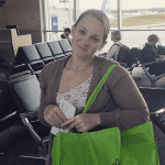 screenshot of a instagram page of Botanica Designs. Young lady dispaying a green carry bag at an airport