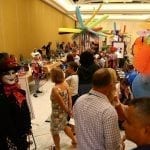 During the “Cirque du Fleur” themed Sylvia Cup Design Competition during SAF Amelia Island 2015, D Damon Samuel, AAF, AIFD, PFCI, NAFD, NMF, of the Bill Doran Company in Omaha, Nebraska, in costume and makeup, welcomed attendees and the general public to watch the contestants in action. See photos from last year’s Sylvia Cup on Flickr.