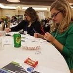 Liz Kemmerer (left), of Bloomtastic Florist in Columbus, and co-worker Katie Devore, are already putting advice learned to use at the shop.