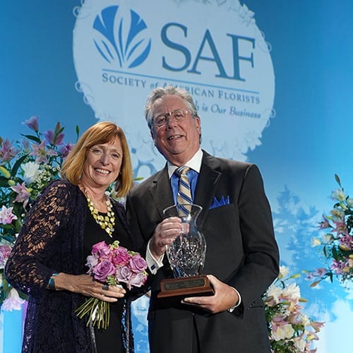 Peter and Sara Moran collecting the Hall of Fame Award in Palm Springs 2018