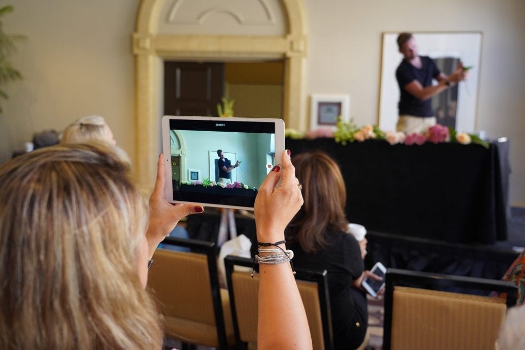Industry members check out new product and the designs of presenter Derek Woodruff, AIFD, PFCI, CF, during the Outstanding Varieties Experience Zone.