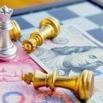 Money game. Chess game. Referring two big countries's conflict. Trade war. Chinese and US bank note under Silver Queen that stands as a winner. International finance concept.