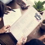 Hands Holding Wedding Planner Checklist Information Preparation